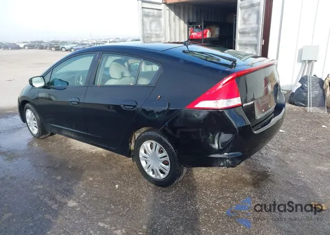 2011 Honda Insight from USA, damaged, VIN JHMZE2H36BS000609